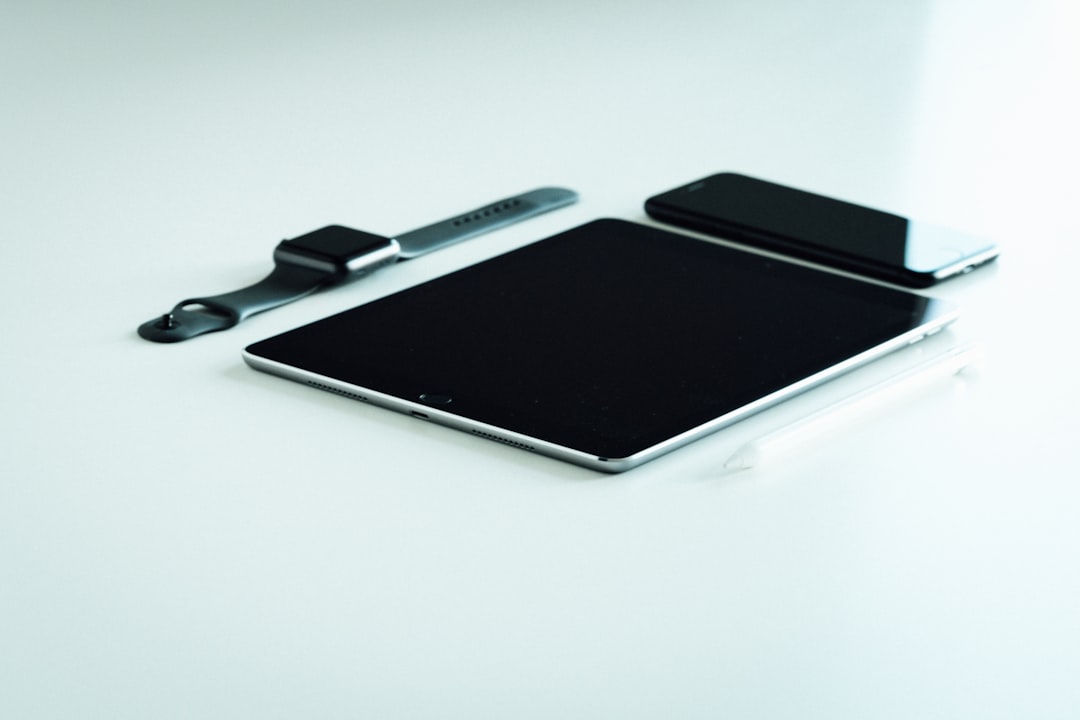 space gray iPad, iPhone, and Apple Watch