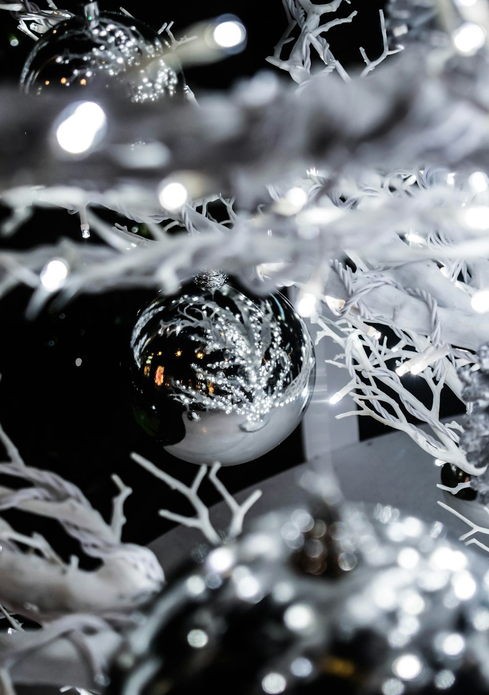 selective focus photography of silver baubles