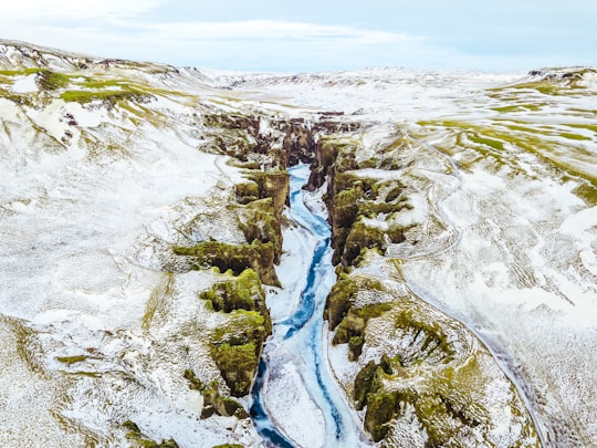 birds eye view of mountain and river in Fjaðrárgljúfur Canyon Iceland