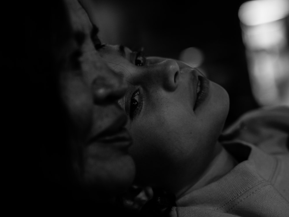 grayscale photo of boy's face