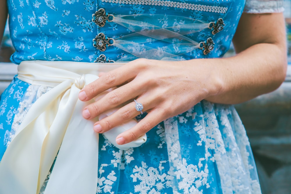 woman wearing white and blue floral dress