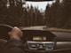 man driving on road