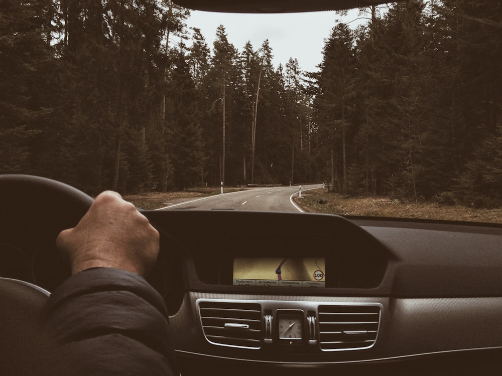 man driving on road