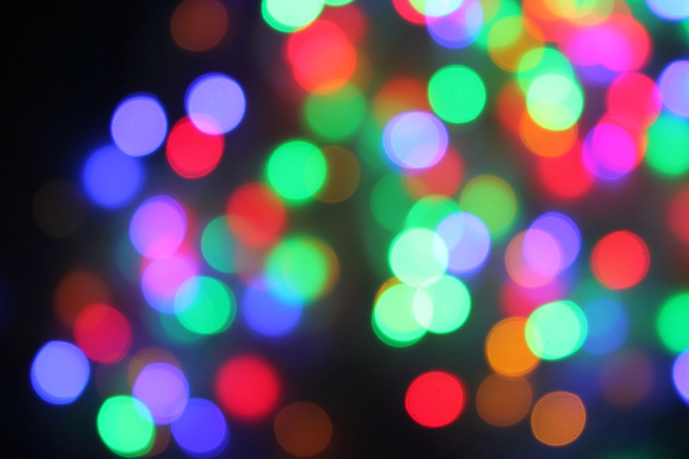 a blurry photo of colorful lights in the dark