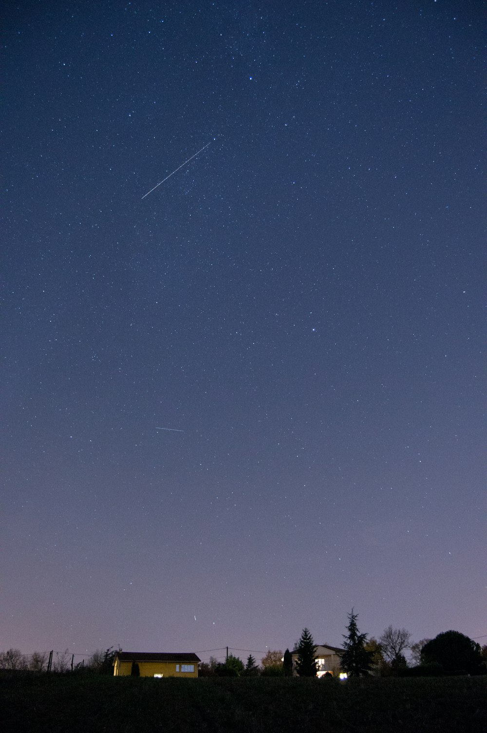 brown house under starry sky during nighttime