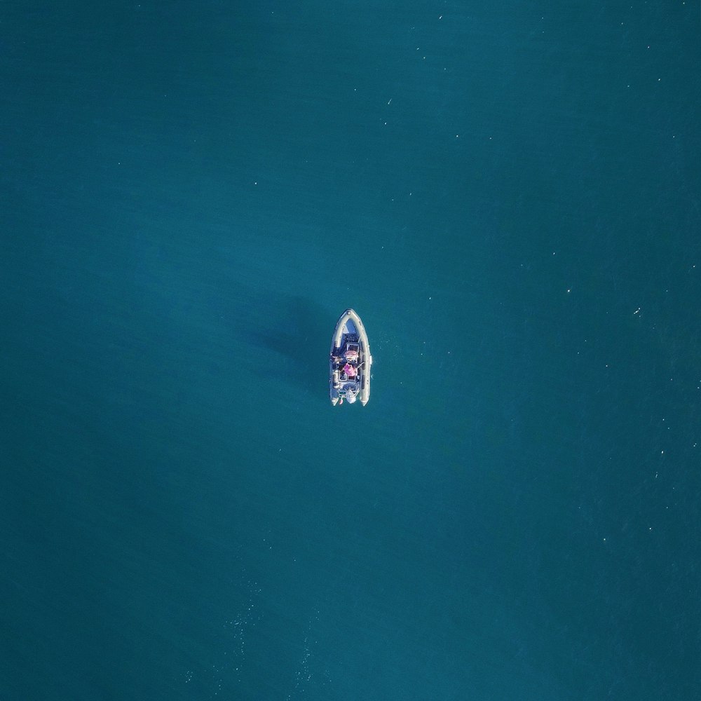 aerial photography of boat with person riding