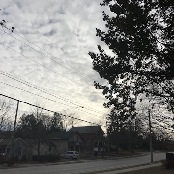 Technicians installing fiber optic cables along a suburban street.