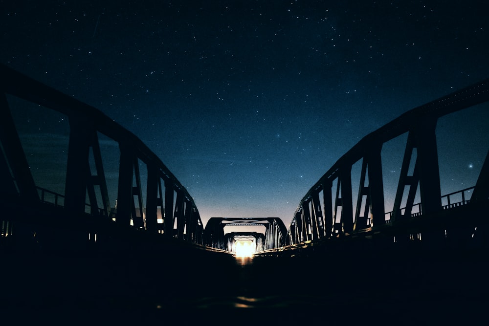 silhouette of gray metal bridge