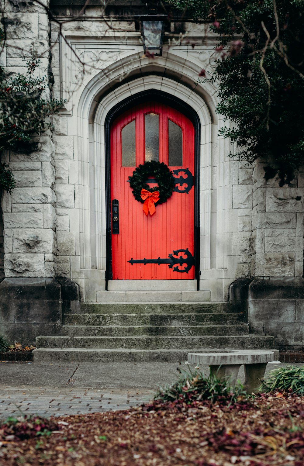 close-up photo of red wooden door