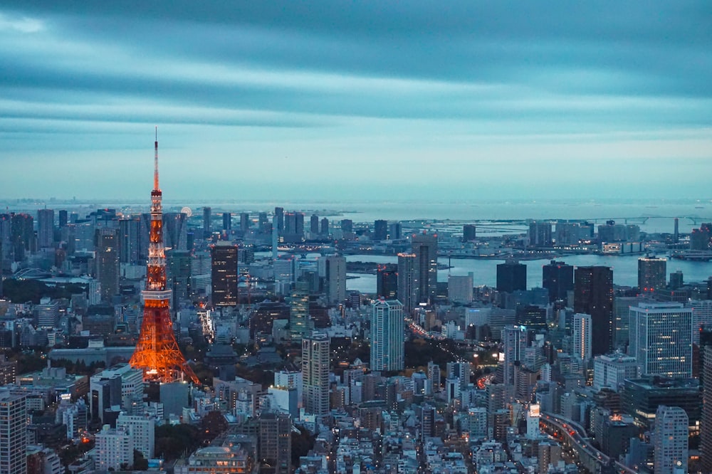 Tokyo Tower lit against the city skyline at dusk