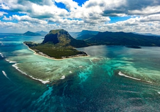 green island in the middle of body of water