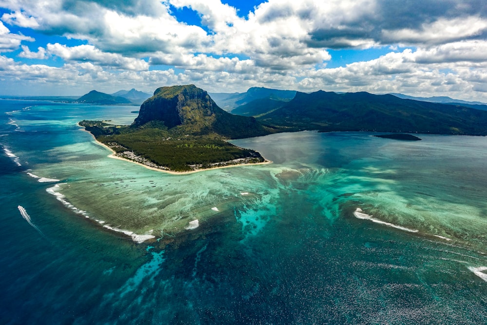 green island in the middle of body of water