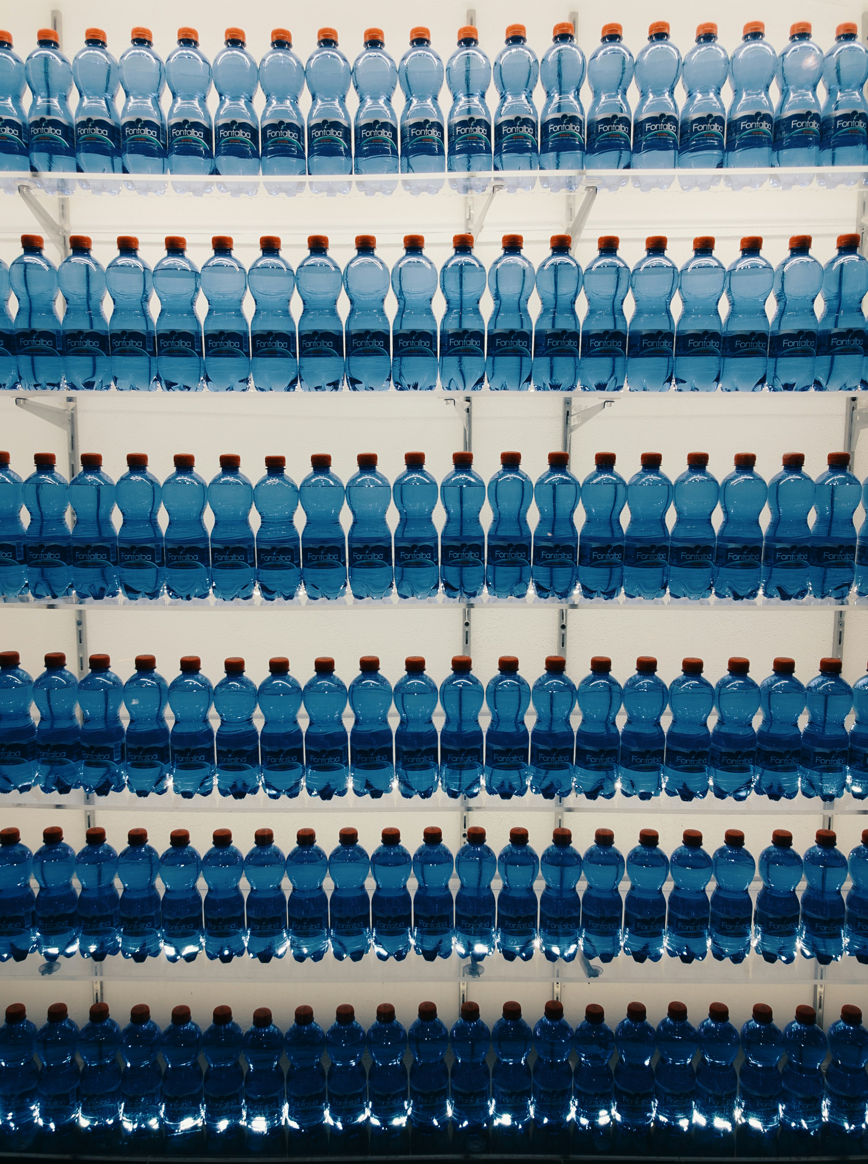 assorted bottled waters on shelf