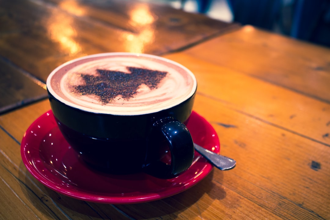 blue cup with cappuccino on red bowl, Christmas hot chocolate from Bela Nova Brockley