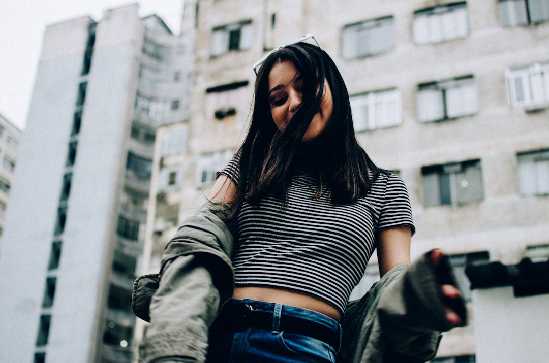 woman wearing striped crop-top and jacket