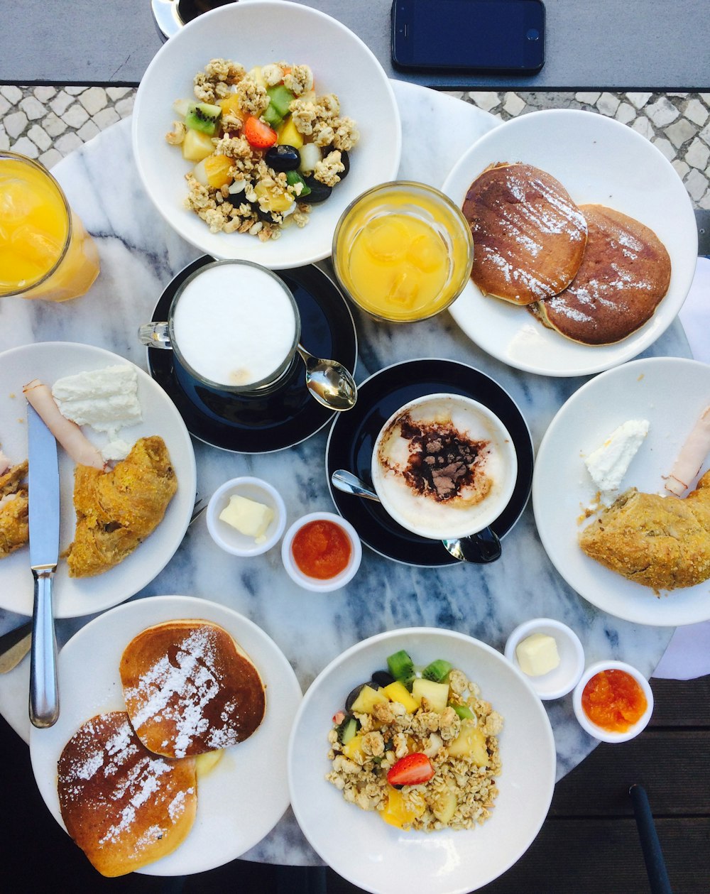 waffles on plate near fried chickens and drinks