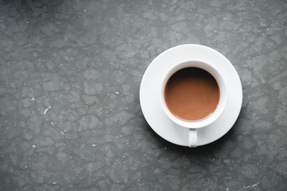 white cup with saucer