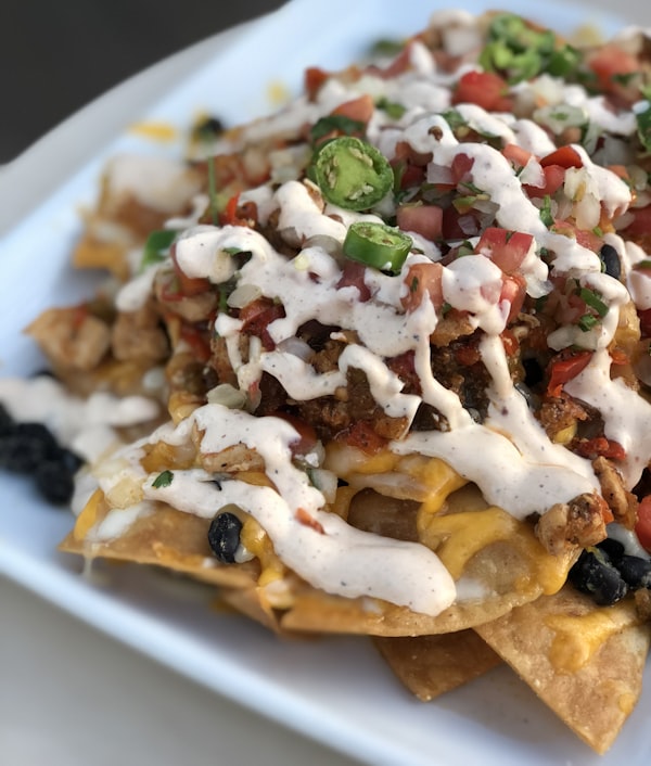 a close-up of nachos on a plate