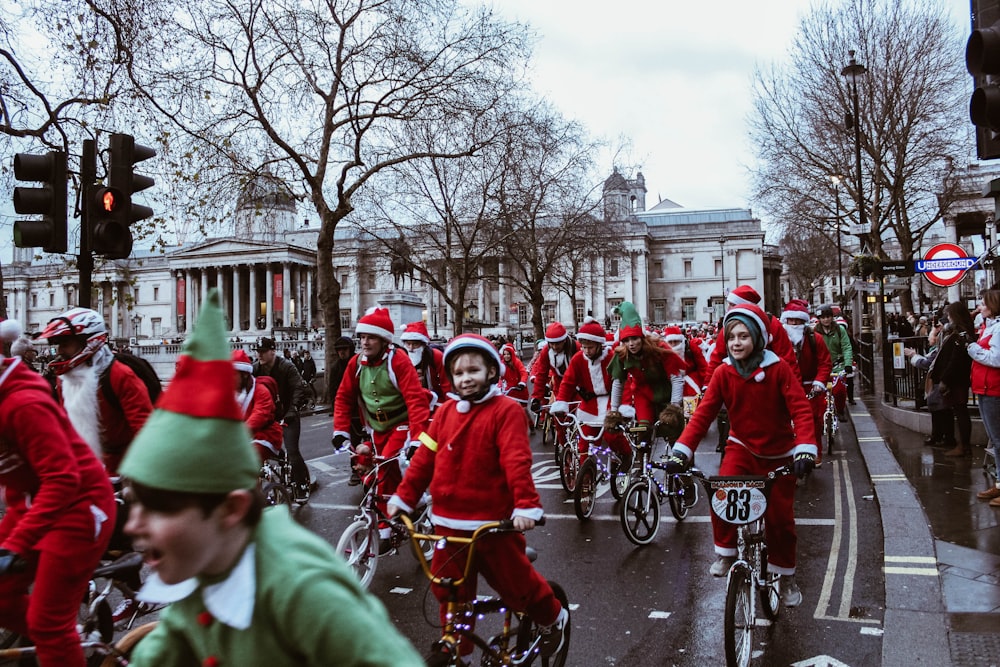 group of children in bicycle near white building