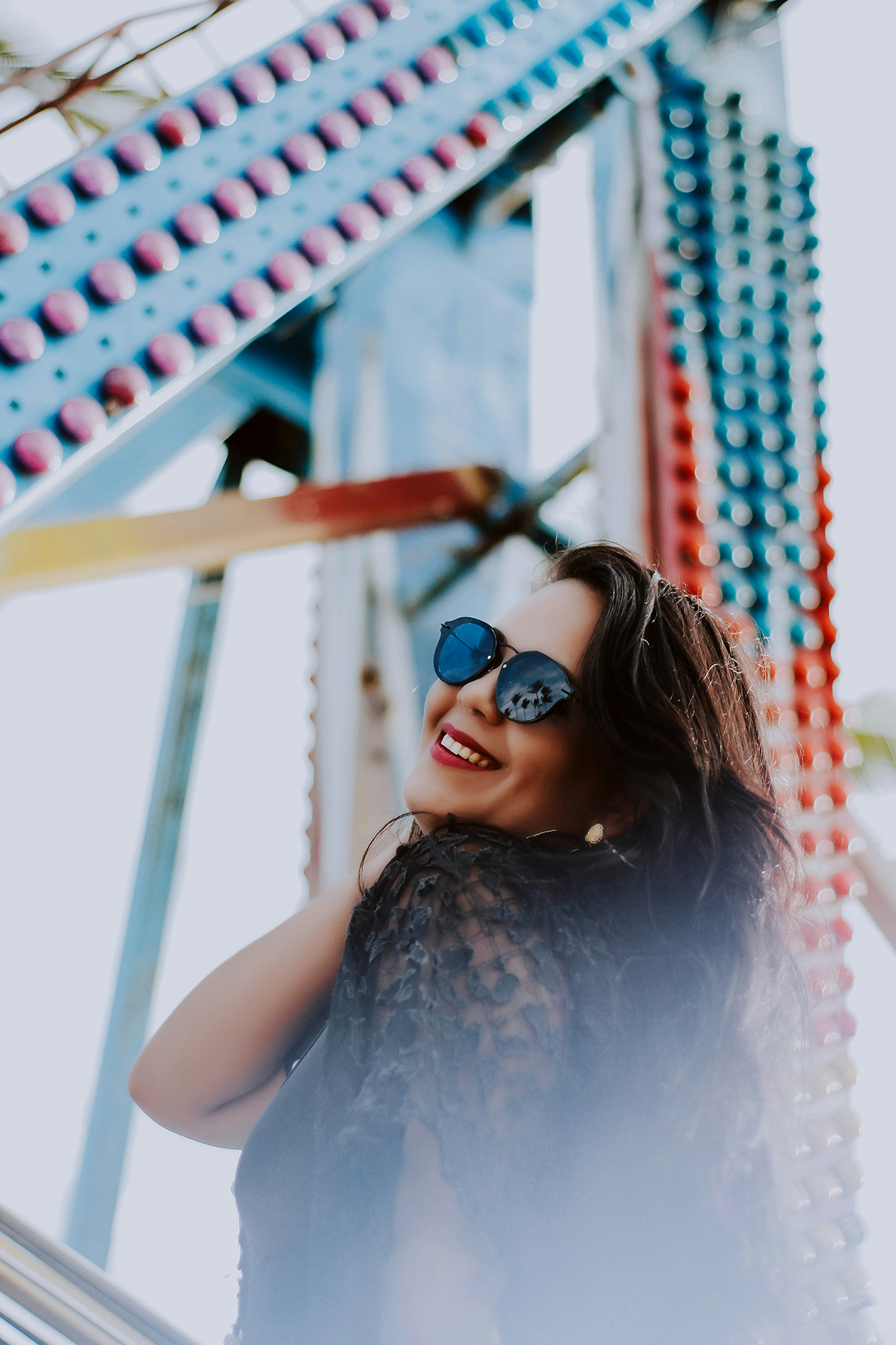 woman standing near blue and red concrete structure during daytime