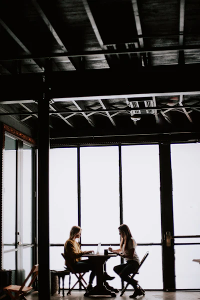 Two women talking over coffee