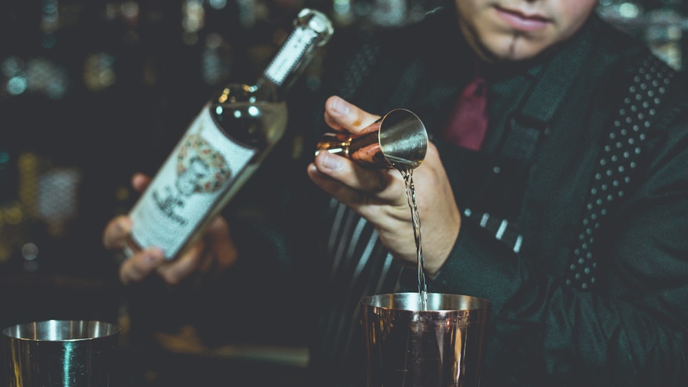 bartender mixing tequila on table