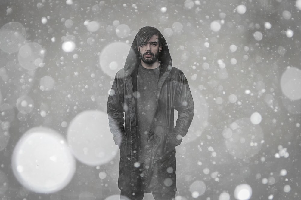 bokeh photography of man wearing coat