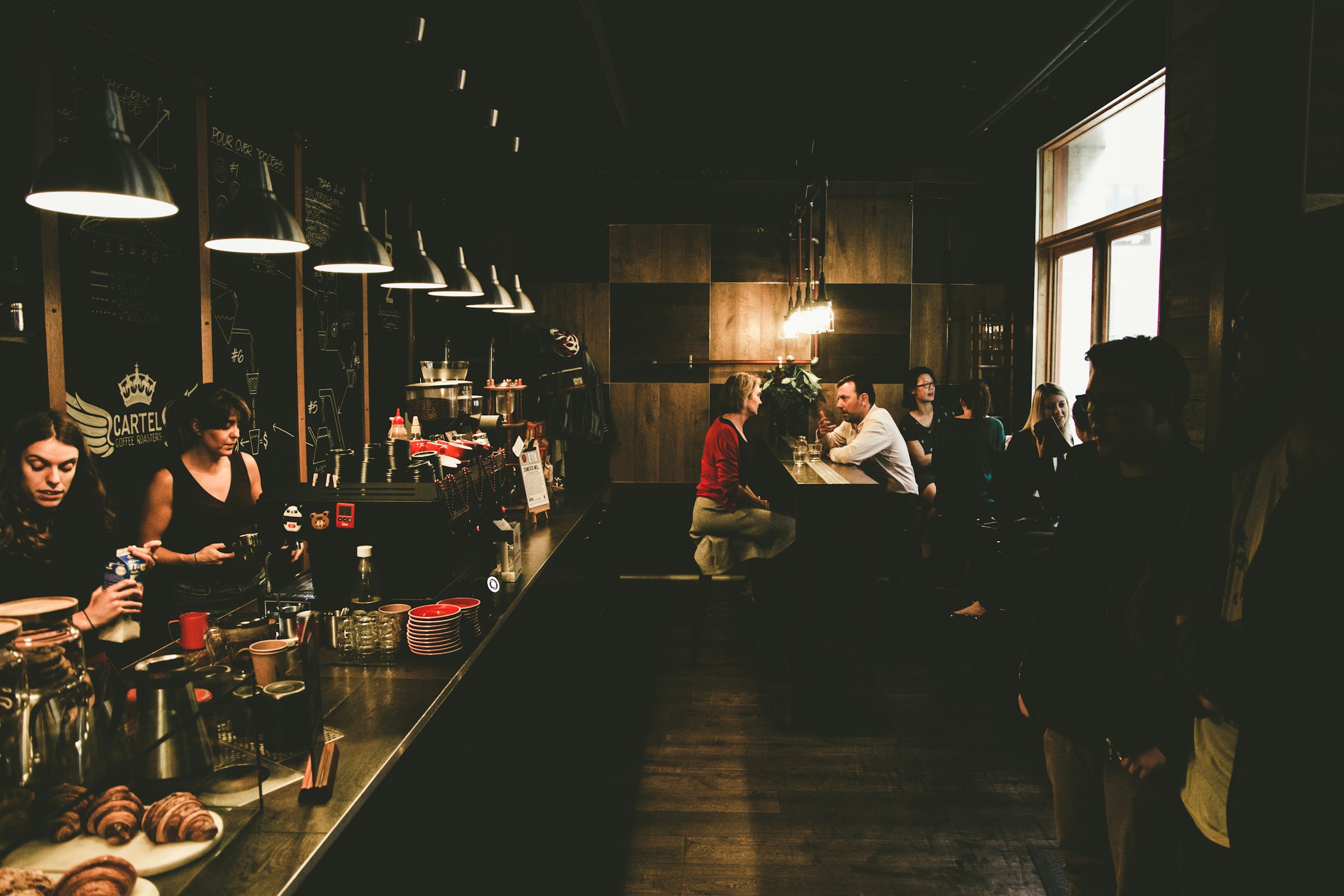 A classic Melbourne laneway cafe with outdoor seating.