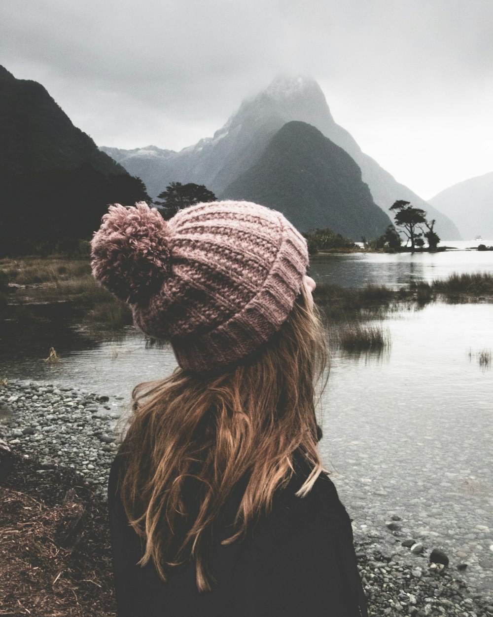 woman watching body of water during daytime