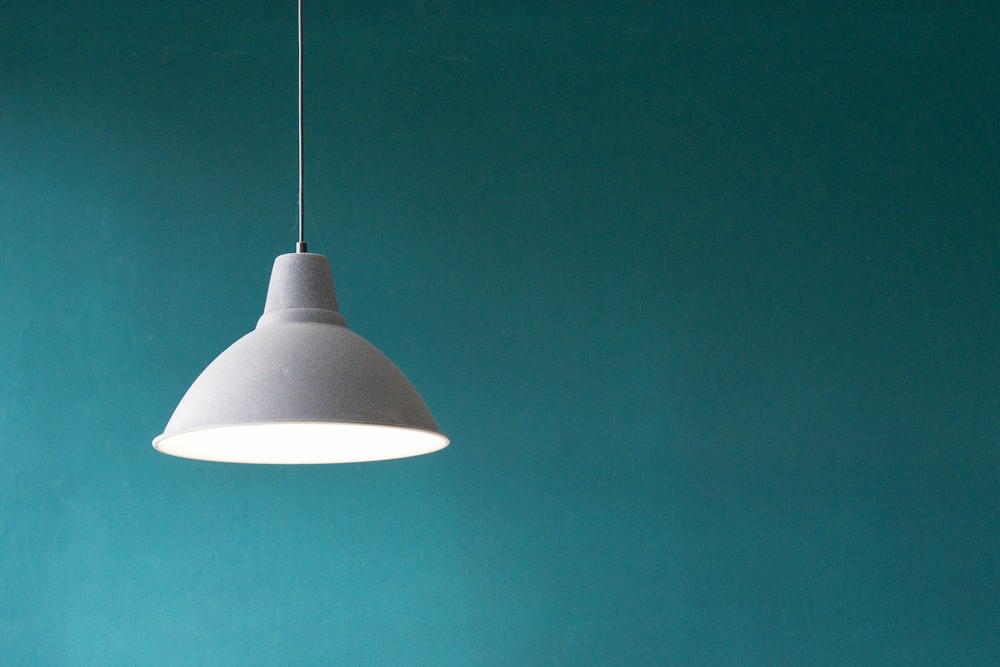 Adjustable task light illuminating a desk during an evening work session