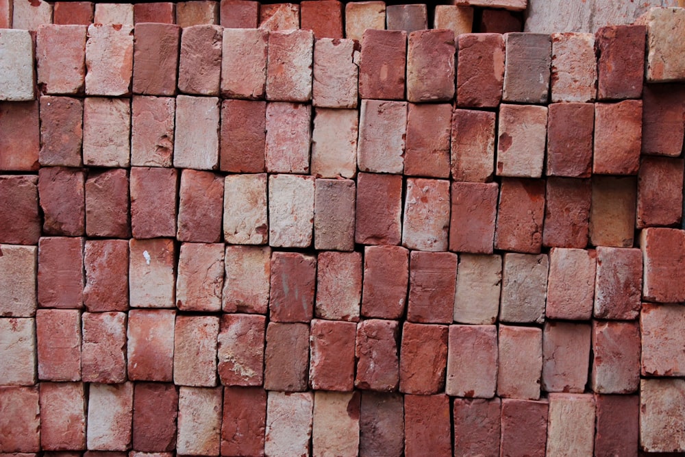 brown brick wall closeup photography