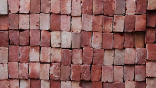 brown brick wall closeup photography