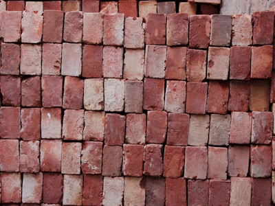 brown brick wall closeup photography