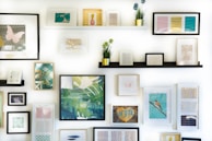 assorted-color framed paintings on the wall