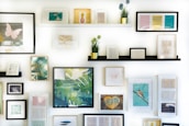 assorted-color framed paintings on the wall