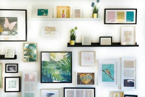 Framed Ferngate prints arranged on a gallery wall