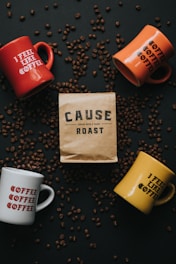 four assorted-color cups