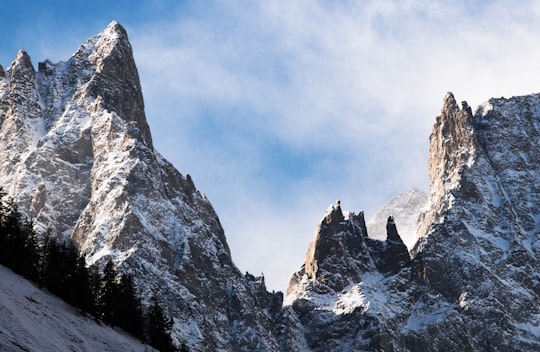 mountain covered with snows under white cloudy sky in Courmayeur Italy