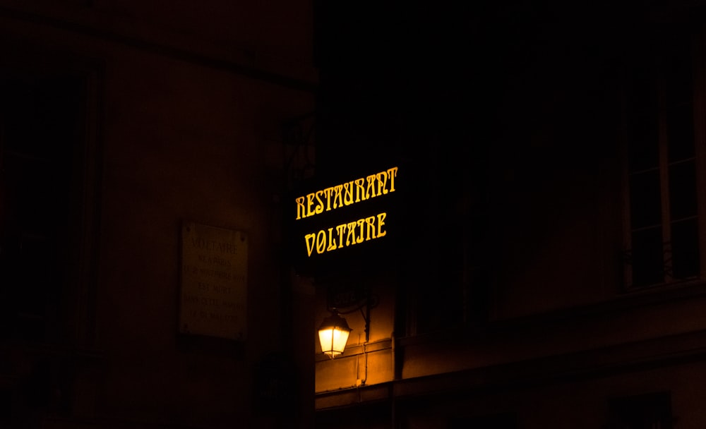 restaurant voltaire neon signage turn-on