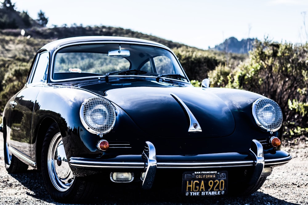 selective focus photography of classic black coupe