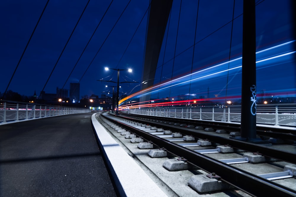 time lapse photo of train railway