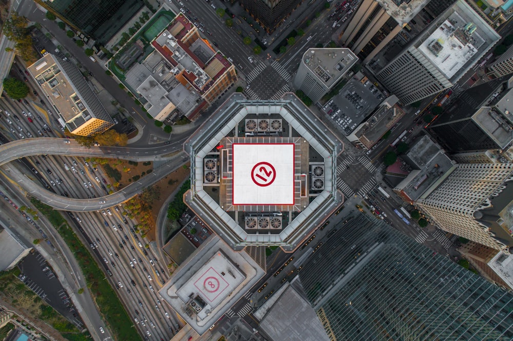 aerial photography building with chopper landing during daytime