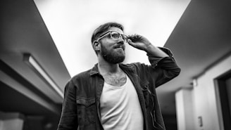 grayscale photo of man standing