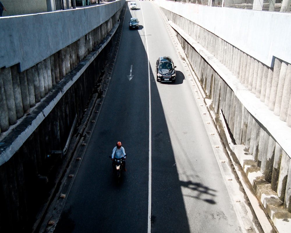 person riding motorcycle in street