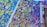 A vibrant mosaic artwork composed of multiple small, colorful tiles arranged in a dynamic, abstract pattern. The tiles vary in color and size, creating an intricate and lively visual effect.
