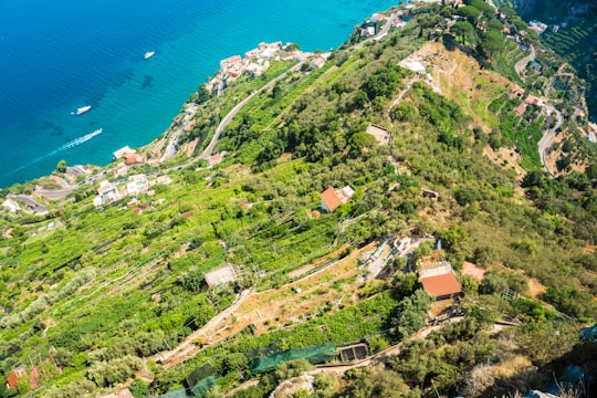 houses surrounded by trees in rock formation in Lattari Mountains Regional Park Italy