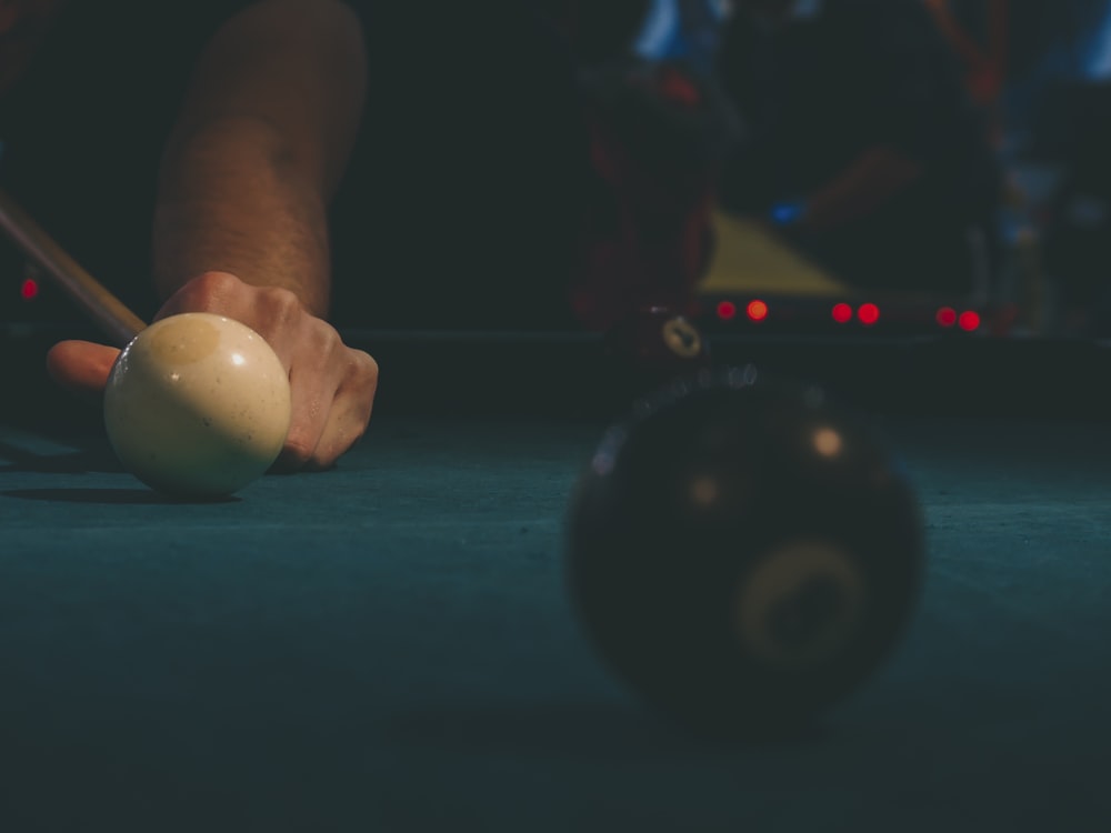 person playing billiards