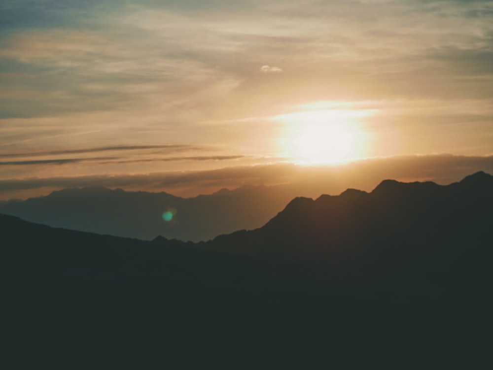 silhouette of mountains during golden hour