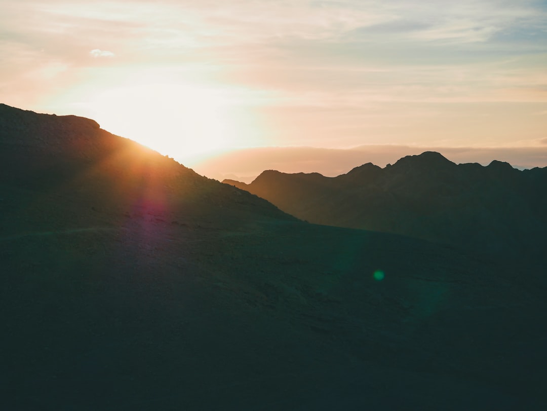 silhouette of mountains during sunset