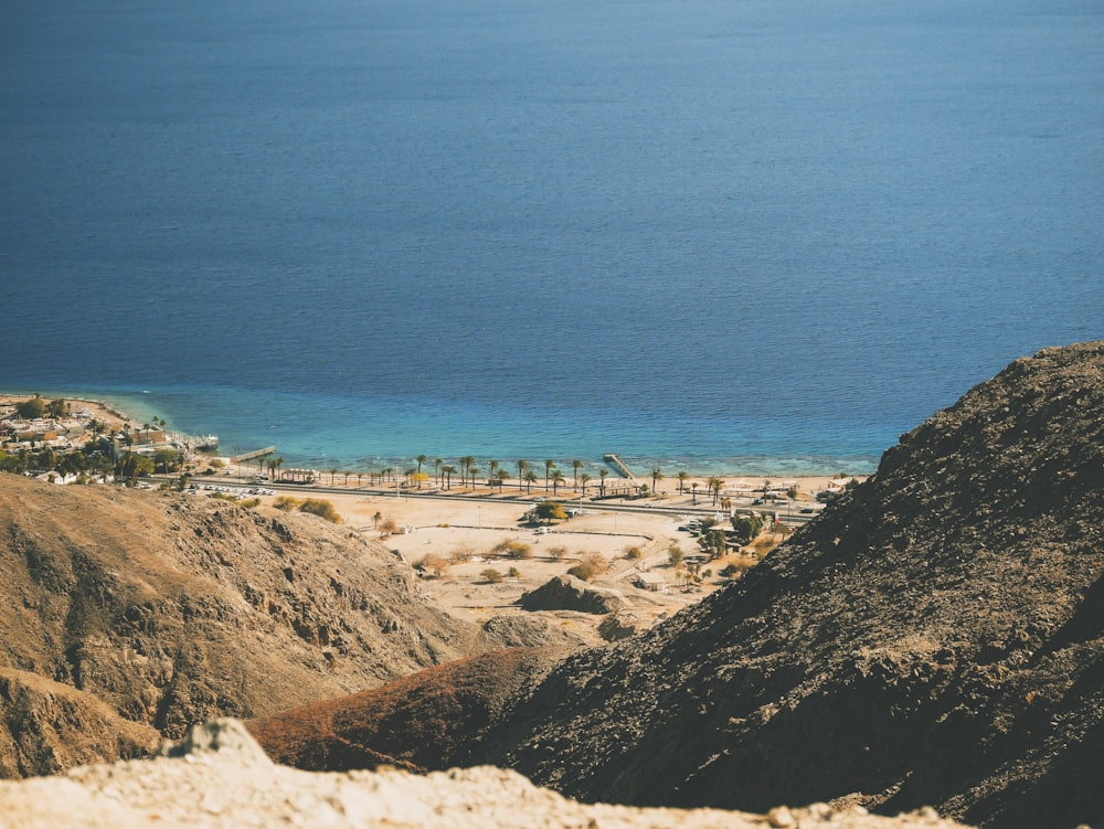 landscape photography of body of water with mountains